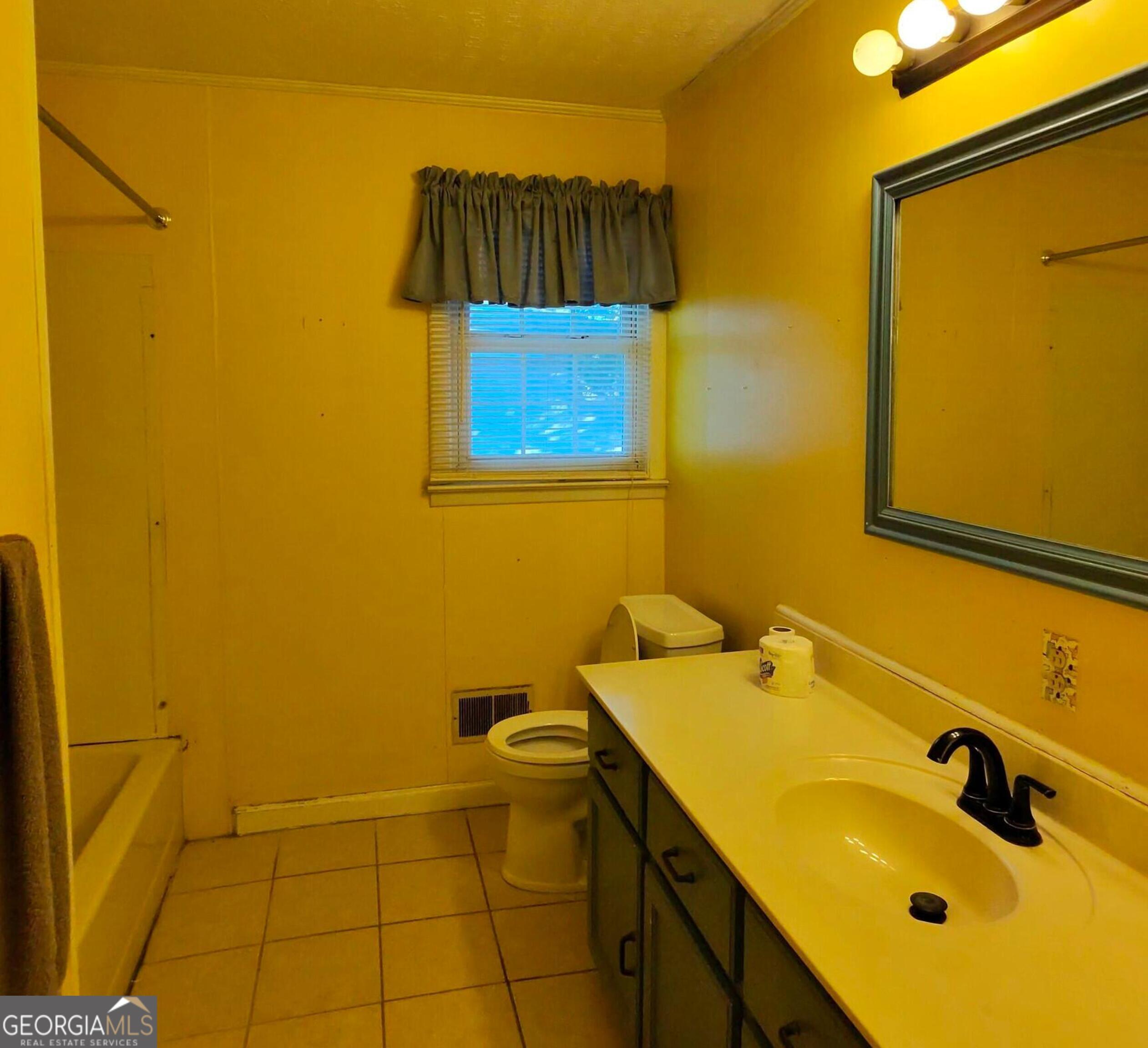 110 Lee Street Centerville, GA 31028 - Photo 13 of 18 a bathroom with a sink and a tub