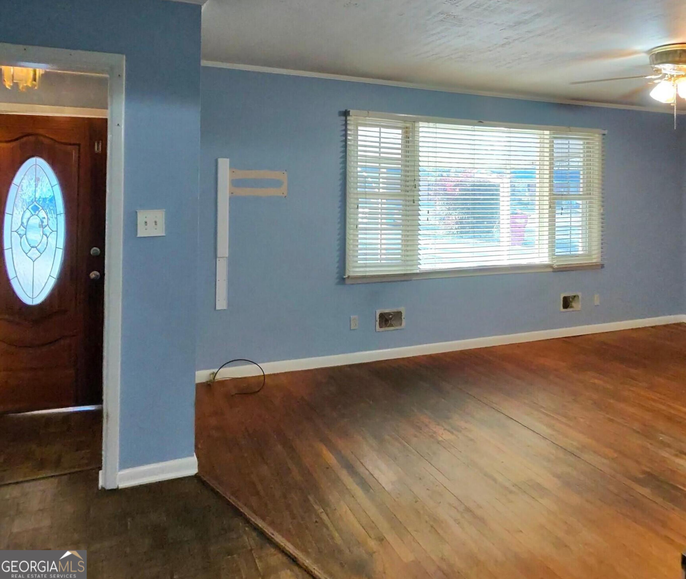 110 Lee Street Centerville, GA 31028 - Photo 3 of 18 a view of wooden floor and windows in a room