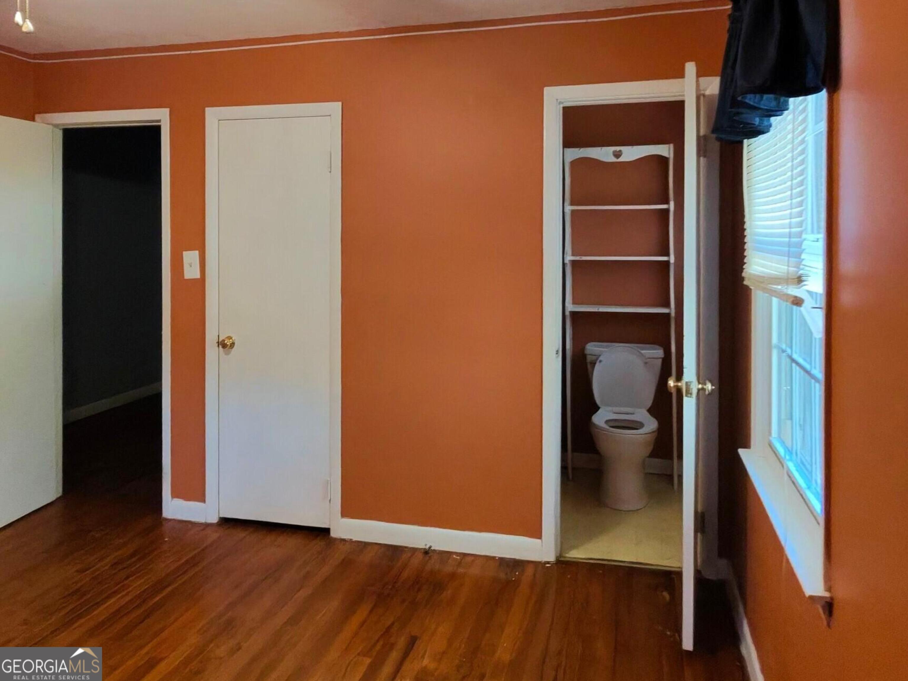 110 Lee Street Centerville, GA 31028 - Photo 9 of 18 an empty room with wooden floor and closet