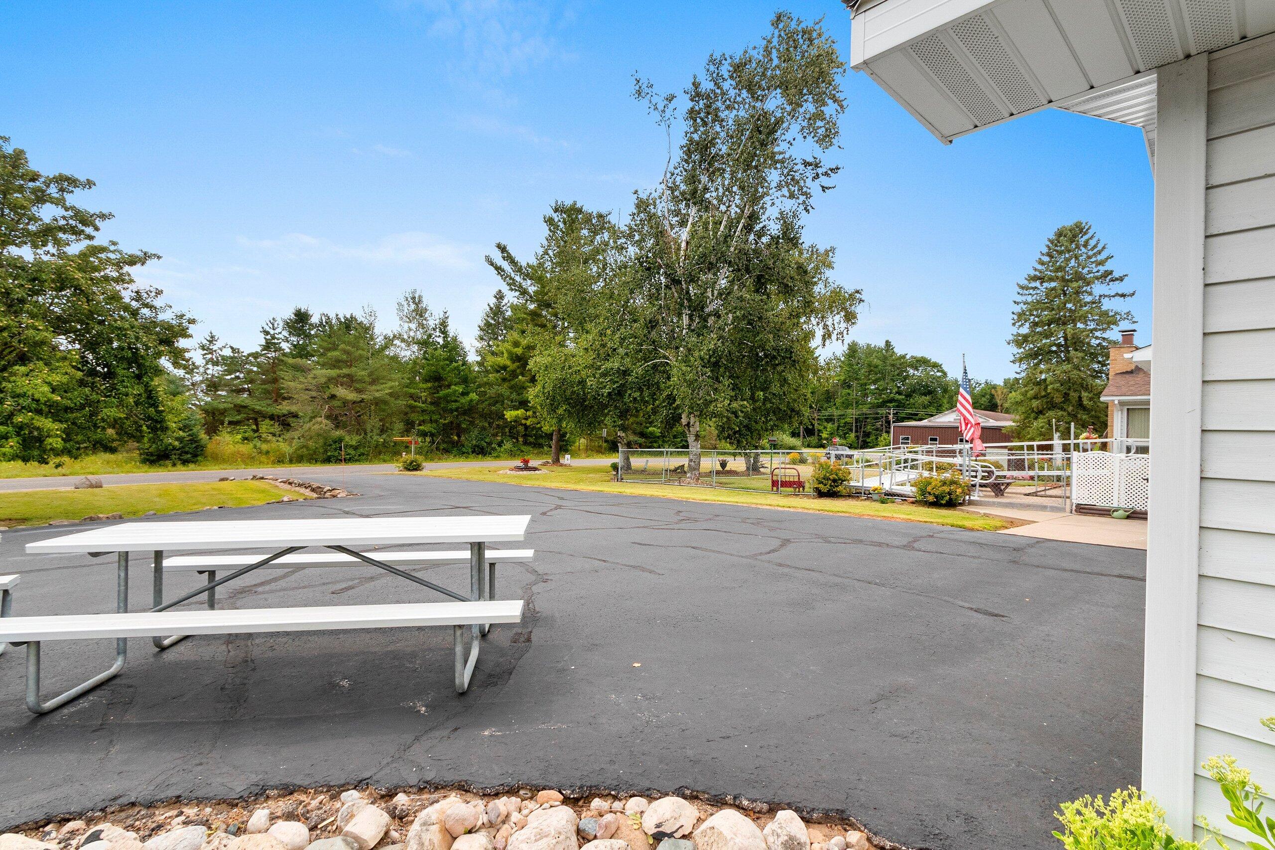 W7478 County Road 358 Daggett, MI 49821 - Photo 33 of 70 Patio area near garage & drive