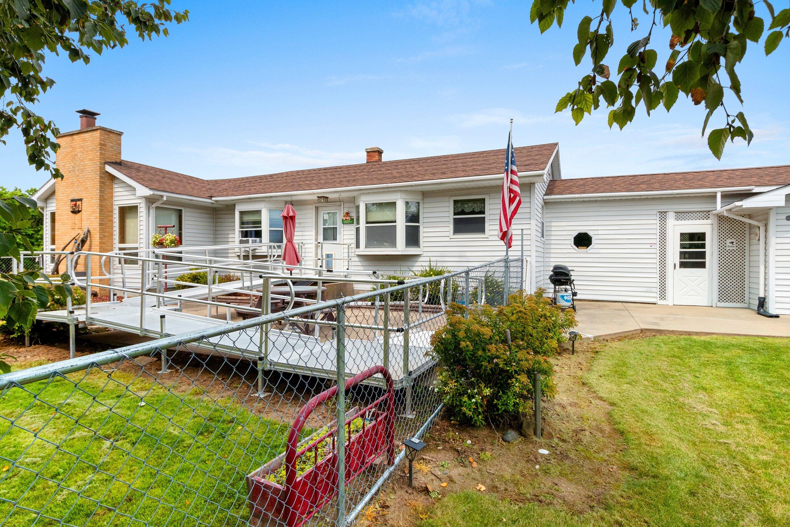 W7478 County Road 358 Daggett, MI 49821 - Photo 34 of 70 Front view 3 with ranp & fenced yard