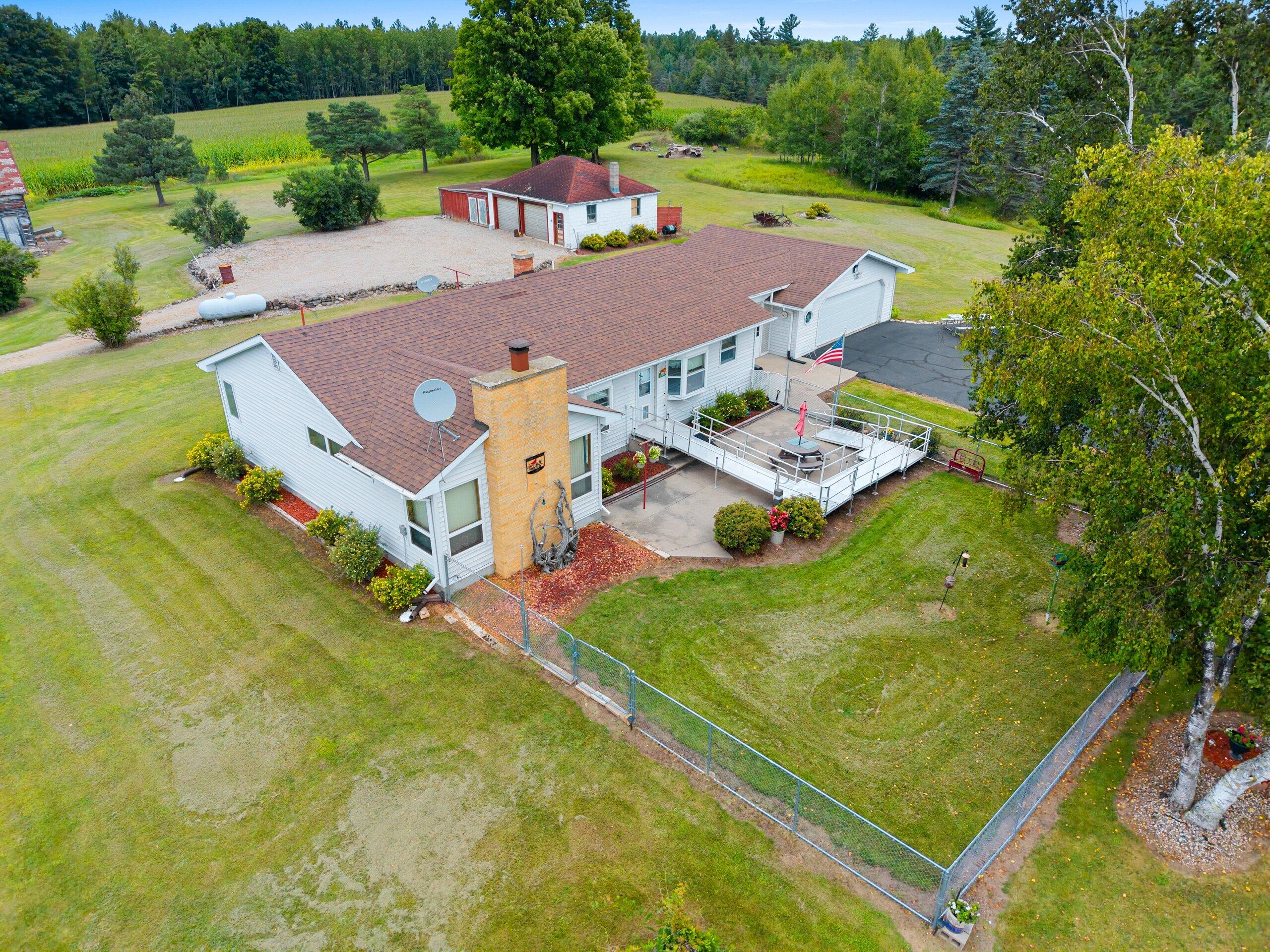 W7478 County Road 358 Daggett, MI 49821 - Photo 58 of 70 Aerial home & fenced front yard