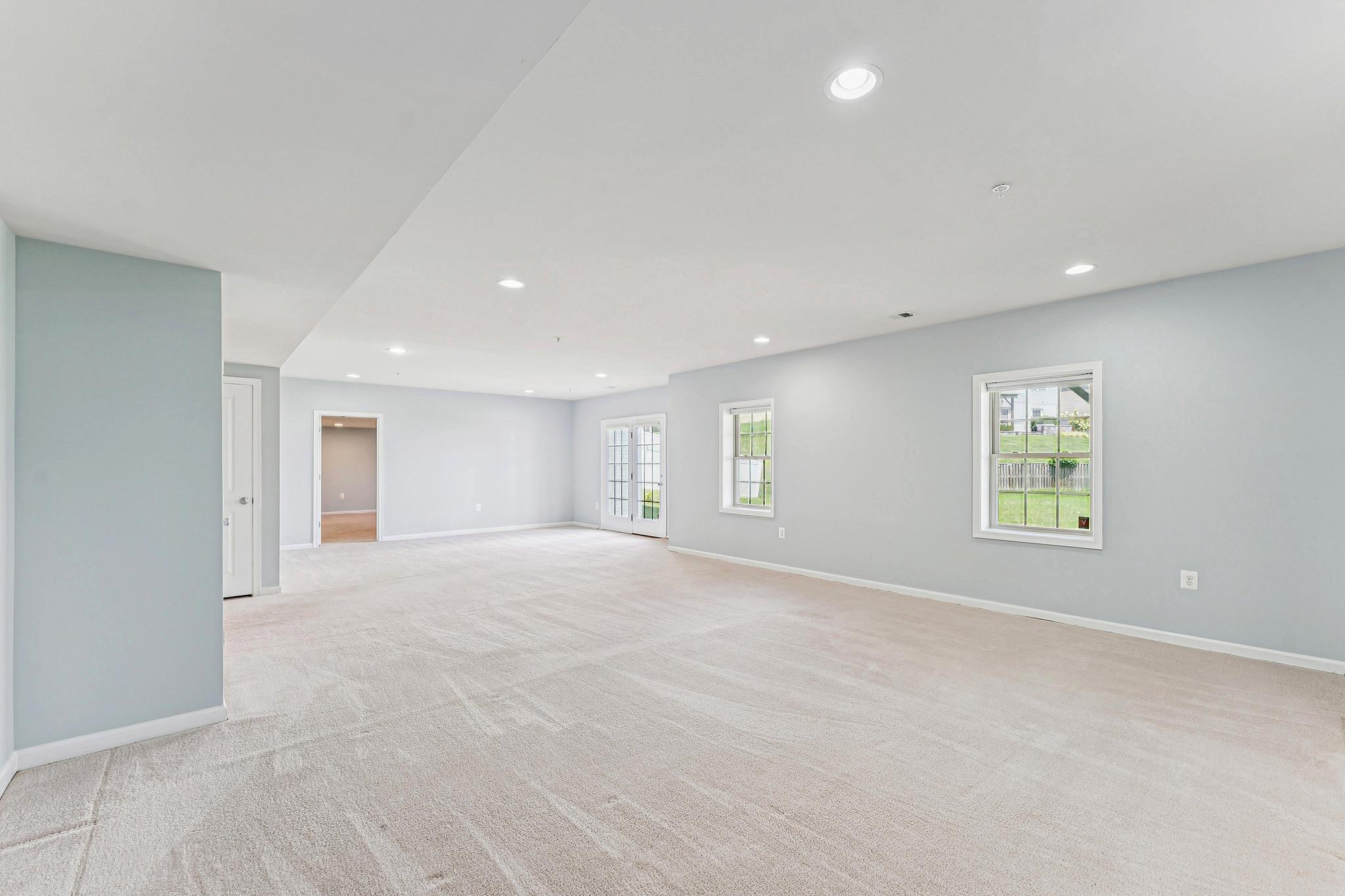1105 Verbena Court Silver Spring, MD 20906 - Photo 51 of 78 Rec Room w/at grade walk out & full-size windows.