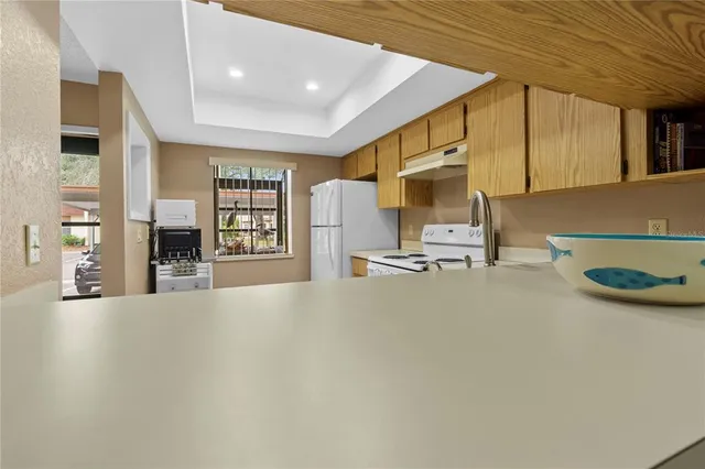 a view of a livingroom with furniture and a fireplace