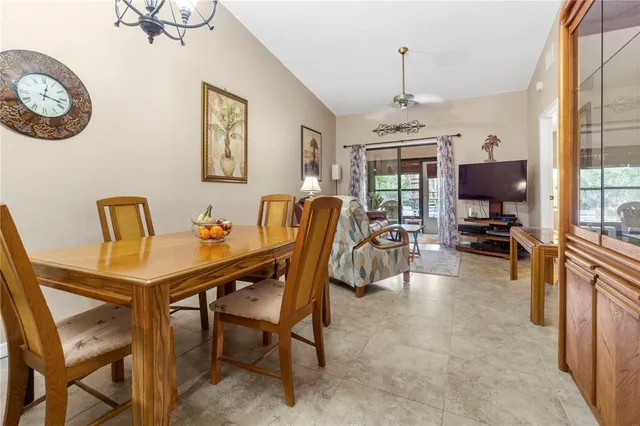 a view of a dining room with furniture window and outside view