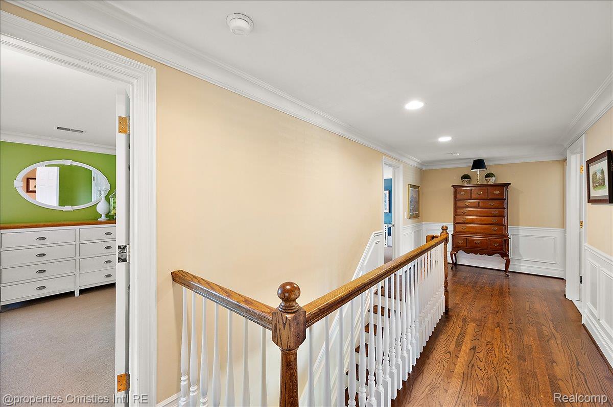 135 Clifton Road Bloomfield Hills, MI 48301 - Photo 52 of 77 Hardwood flooring throughout the hallway