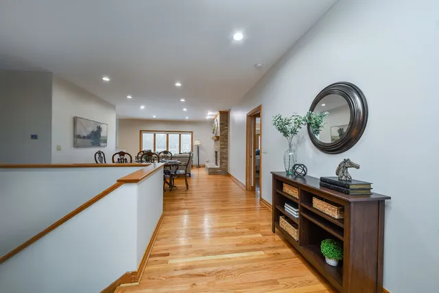 a dining hall with stainless steel appliances granite countertop a stove a sink a refrigerator and a microwave