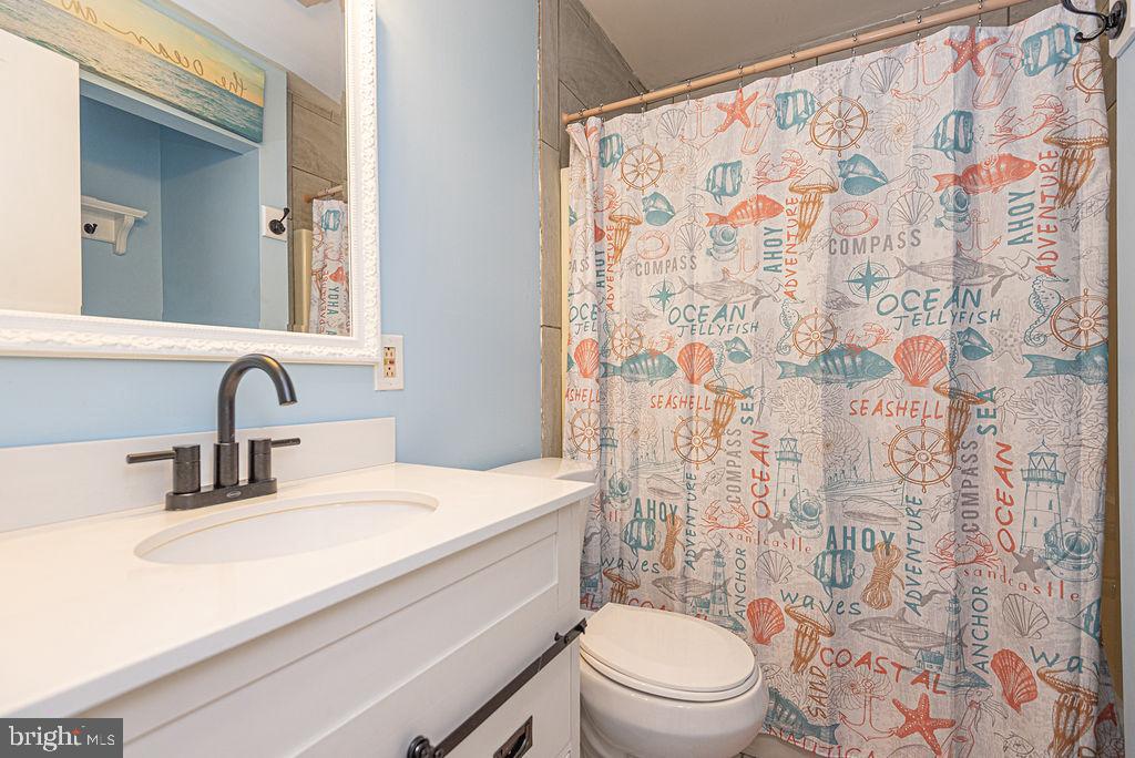 63 Drawbridge Road Ocean Pines, MD 21811 - Photo 39 of 102 a bathroom with a sink toilet and shower