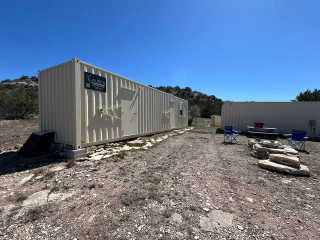 a kitchen with a sink a microwave a stove and refrigerator