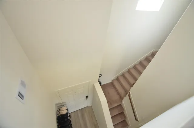 a bedroom with a bed and a desk