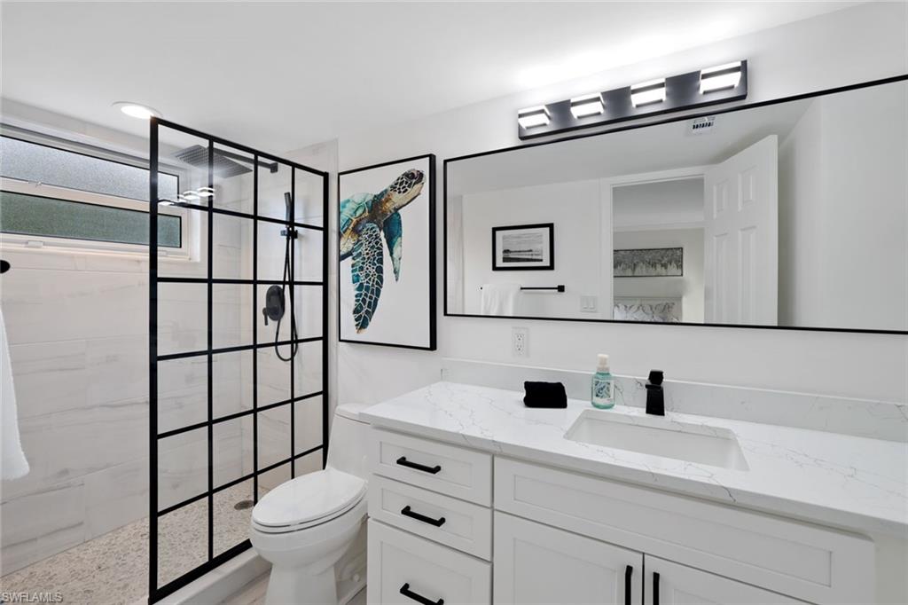 960 7th Street South, Unit 105 Naples, FL 34102 - Photo 12 of 19 Spacious bathroom with modern finishes.