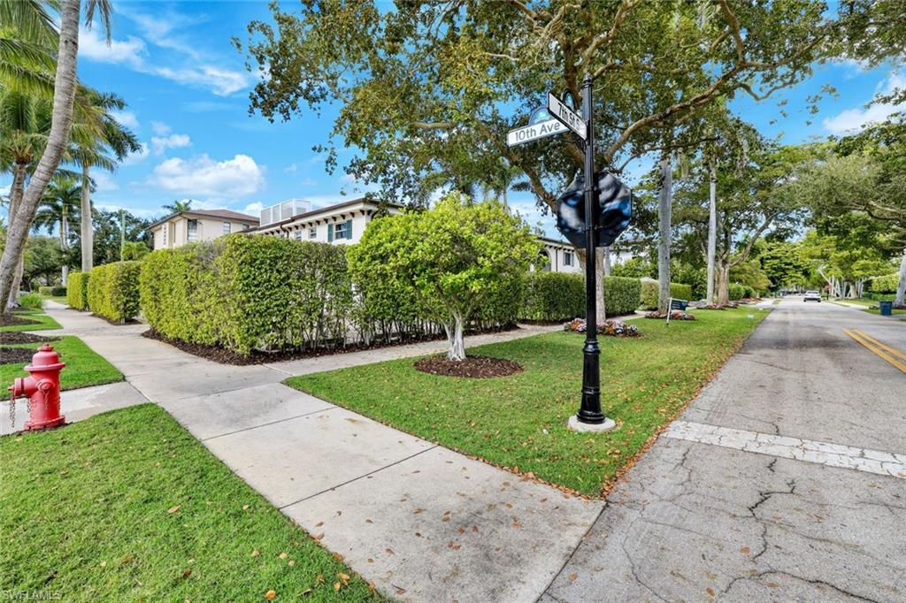 960 7th Street South, Unit 105 Naples, FL 34102 - Photo 18 of 19 Charming neighborhood setting with shaded walking paths and lush greenery.