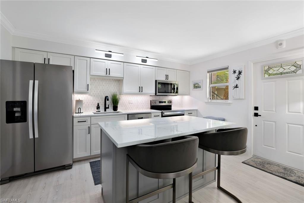 960 7th Street South, Unit 105 Naples, FL 34102 - Photo 2 of 19 This kitchen truly is the HEART of the home.