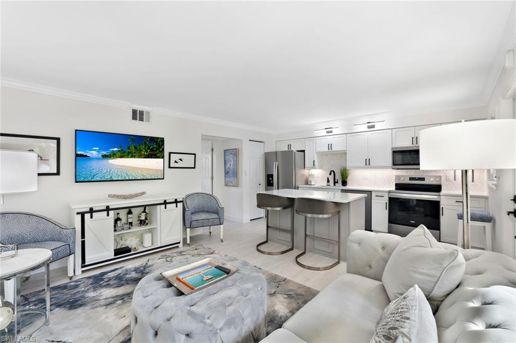 960 7th Street South, Unit 105 Naples, FL 34102 - Photo 3 of 19 The kitchen is convenient to living/dining room. Entertain with ease!