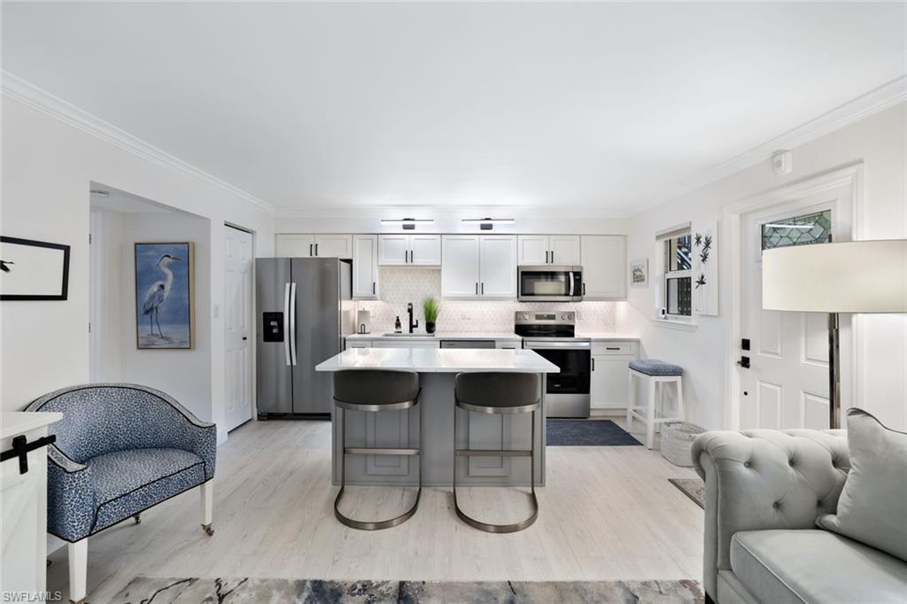 960 7th Street South, Unit 105 Naples, FL 34102 - Photo 5 of 19 Enjoy meals at this beautifully updated island!