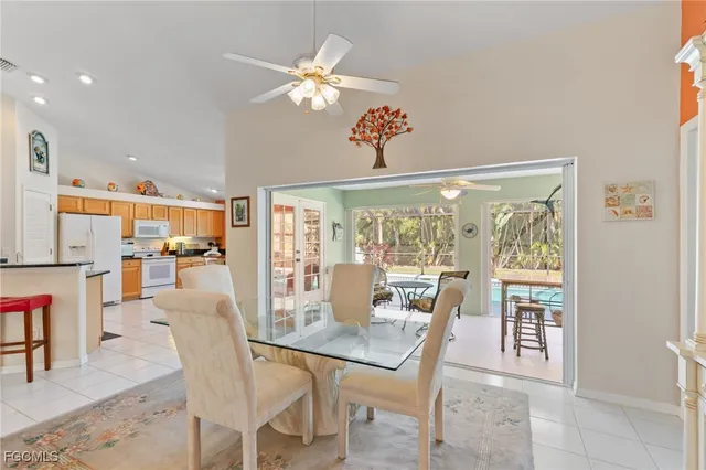 a view of a dining room with furniture wooden floor and chandelier