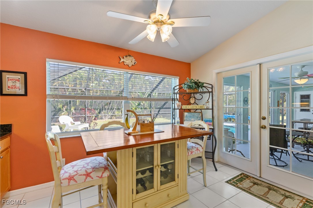 7660 Grande Pine Road Bokeelia, FL 33922 - Photo 8 of 33 a view of a dining room with furniture window and outside view