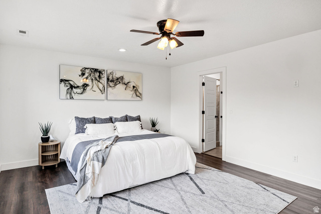 1552 Sumac Drive Logan, UT 84321 - Photo 20 of 72 Bedroom featuring wood-finish flooring, white walls, and a ceiling fan with integrated lighting