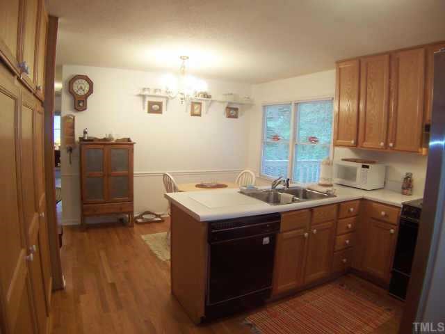 6029 Bellow Street Raleigh, NC 27609 - Photo 4 of 12 Open Kitchen leads to the spacious deck
