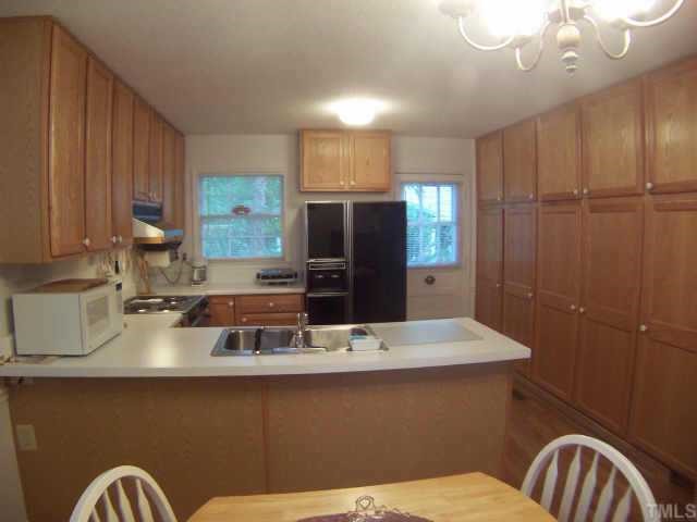 6029 Bellow Street Raleigh, NC 27609 - Photo 5 of 12 Kitchen offers wall to wall Pantry