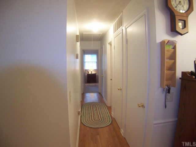 6029 Bellow Street Raleigh, NC 27609 - Photo 6 of 12 Hallway leading to bedrooms