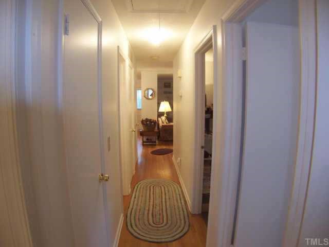 6029 Bellow Street Raleigh, NC 27609 - Photo 10 of 12 Hallway leading back to the living room