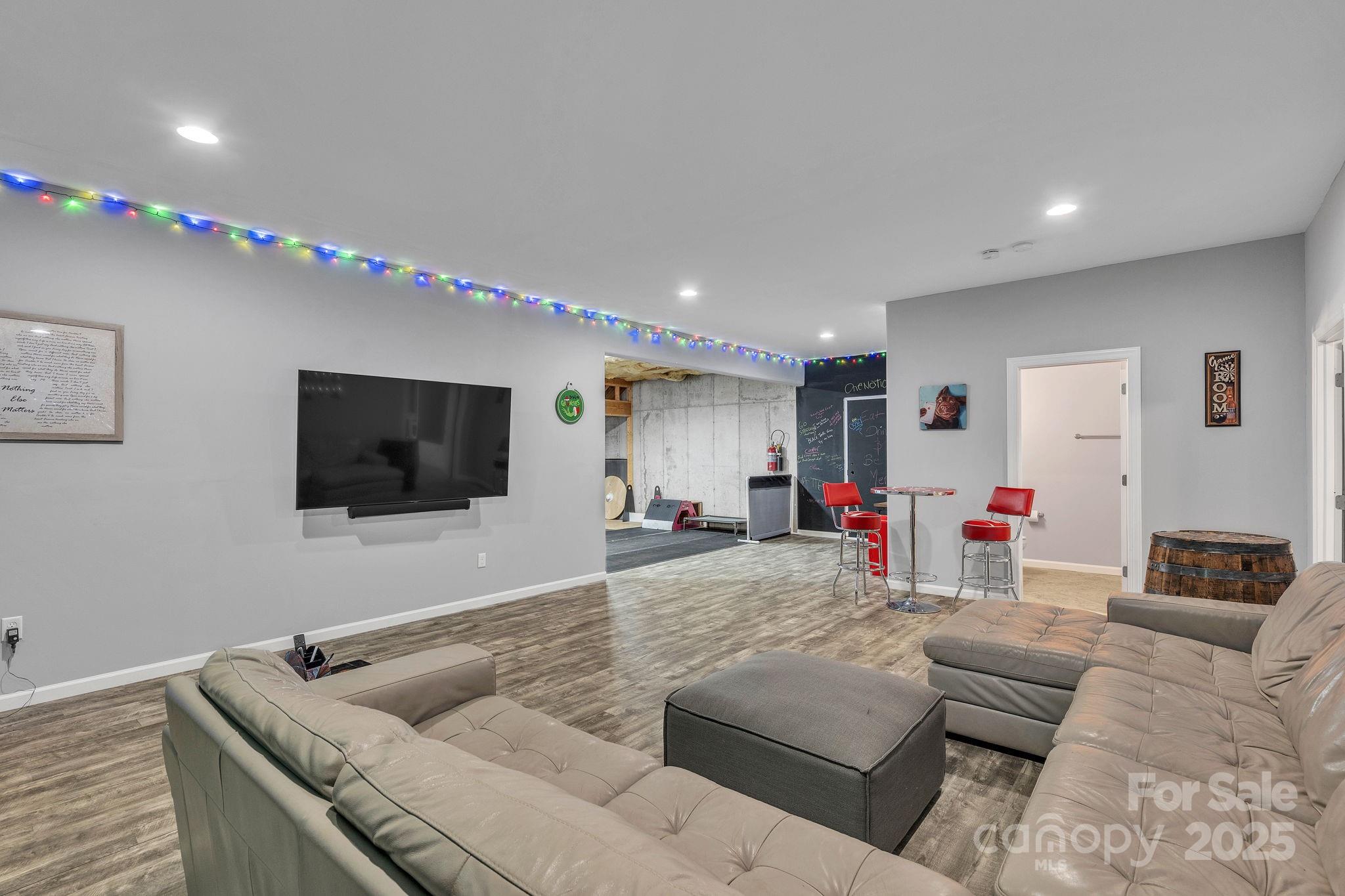 220 Alvin Hough Road Midland, NC 28107 - Photo 27 of 46 a living room with furniture and a flat screen tv