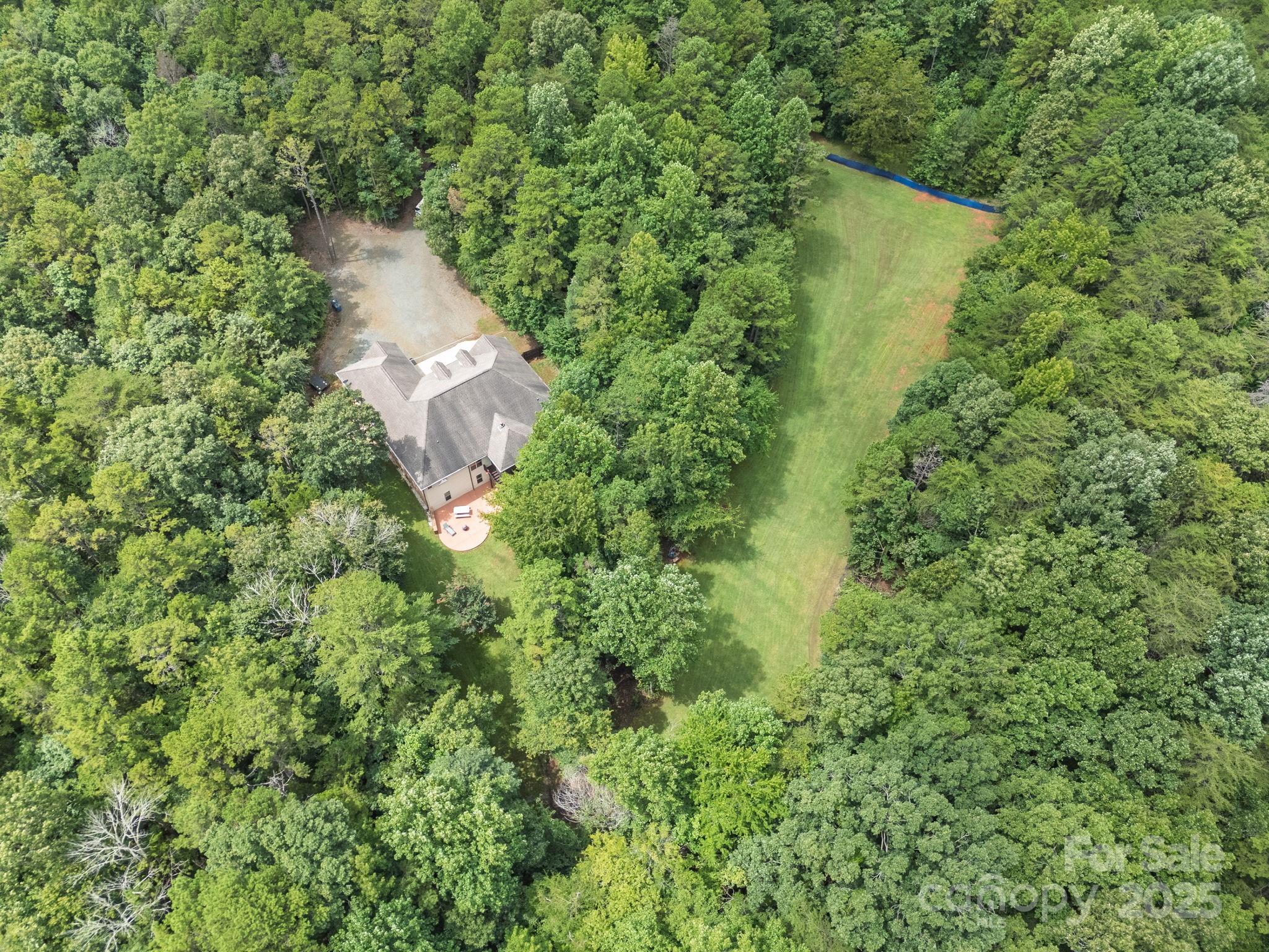 220 Alvin Hough Road Midland, NC 28107 - Photo 42 of 46 a aerial view of a house with a yard and large trees