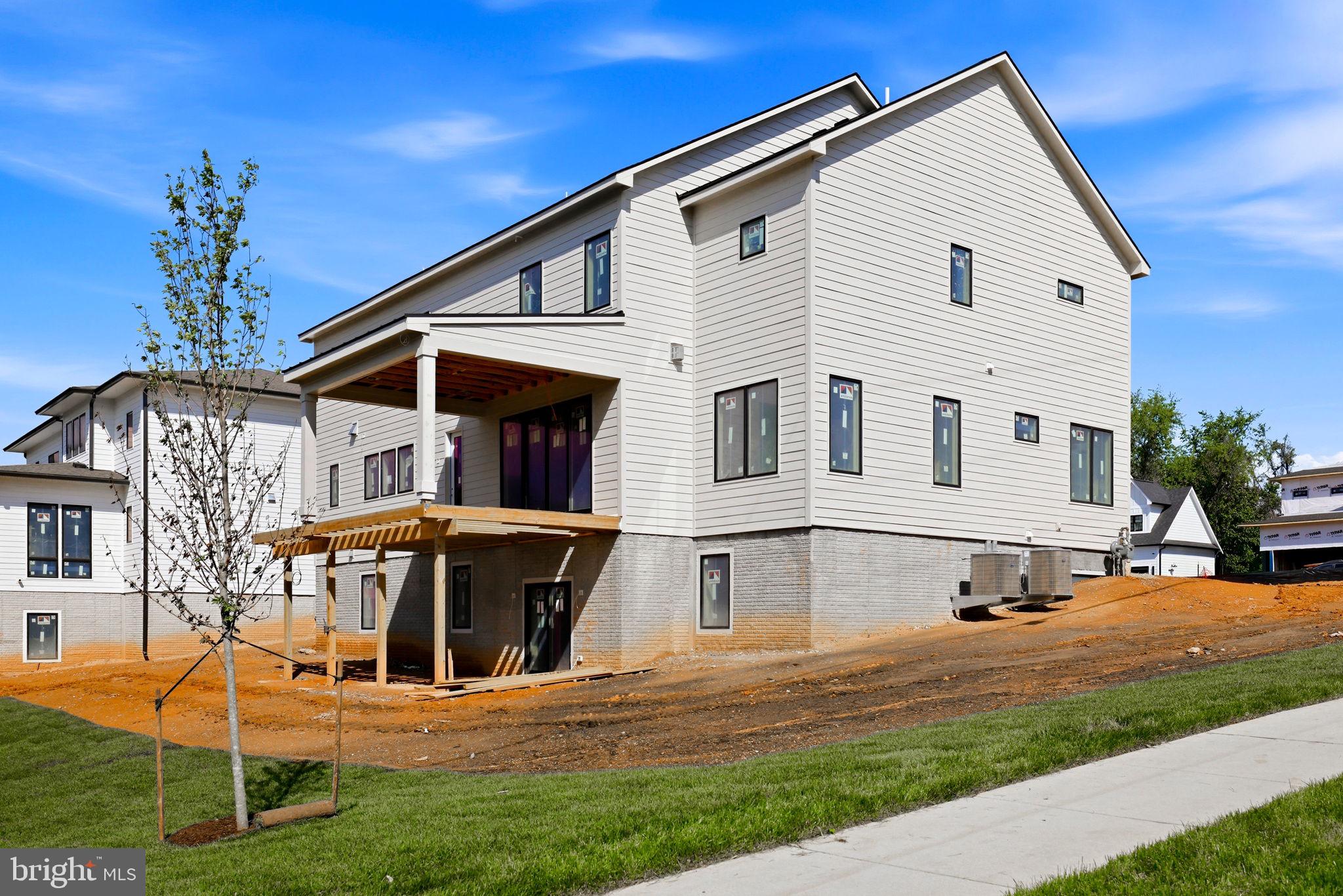 10801 Mason Hunt Court Reston, VA 20190 - Photo 8 of 26 a view of a house with pool and chairs