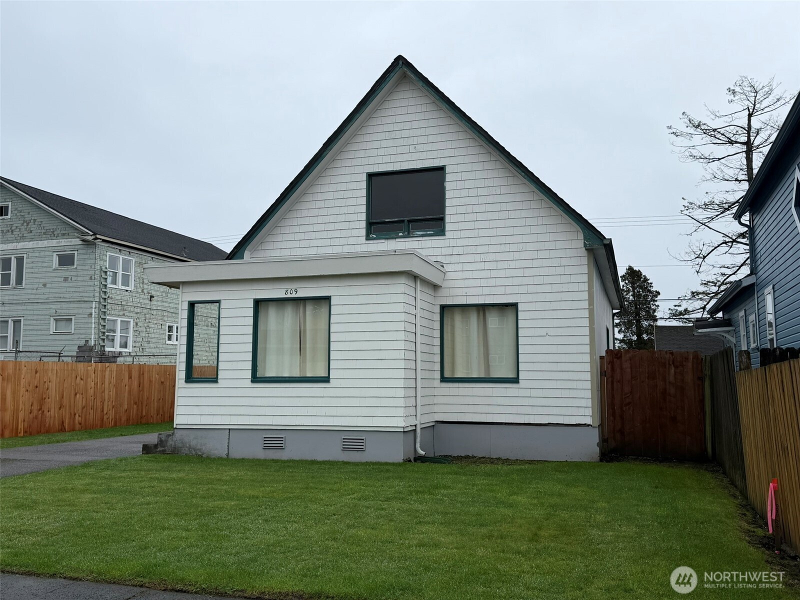 809 West Market Street Aberdeen, WA 98520 - Photo 2 of 39 a view of a house with a yard