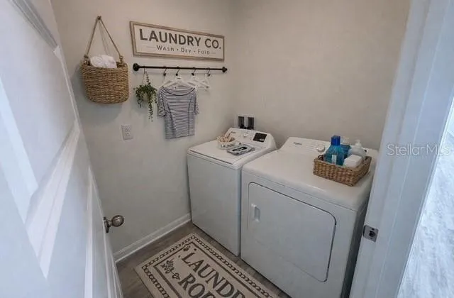 a utility room with dryer and washer