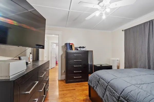 a bedroom with a bed and a dresser