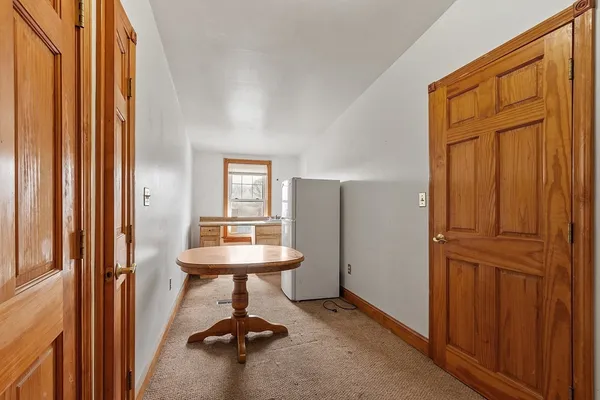 a view of a livingroom with furniture and a window