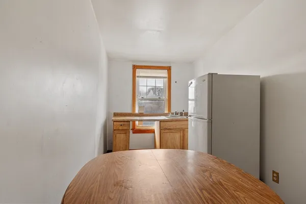 a kitchen with stainless steel appliances a refrigerator and a stove