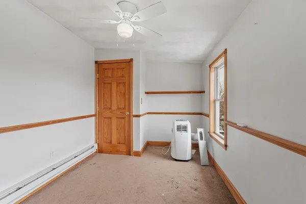 a view of a storage & utility room with a window