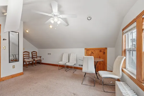 a view of living room with furniture and a window