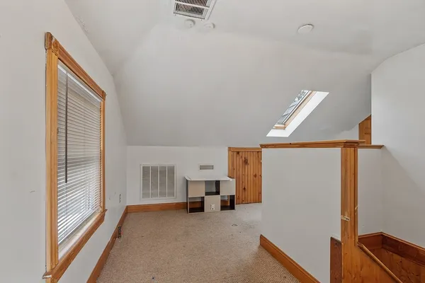 a view of livingroom with furniture and refrigerator