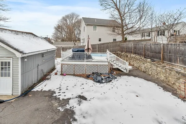 a white house that has a tree in it