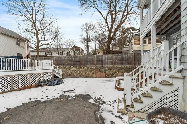 a view of a patio with a table and chairs