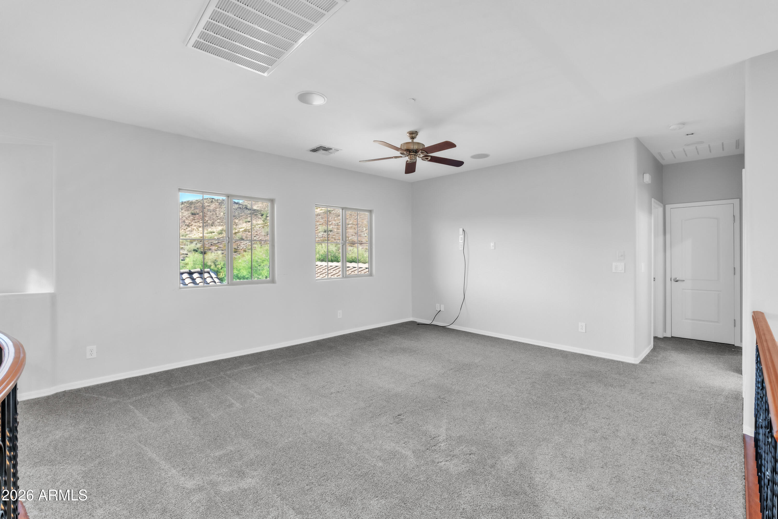 1615 West Red Fox Road Phoenix, AZ 85085 - Photo 44 of 64 a view of an empty room with a window