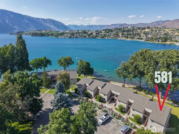 a view of a swimming pool with a yard