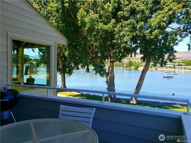 a dining room with furniture window and wooden floor