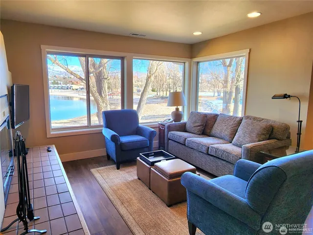 a living room with furniture and a large window