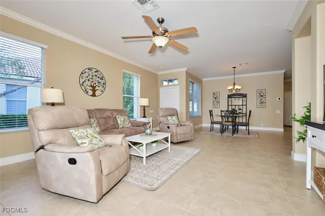 a living room with furniture and white walls