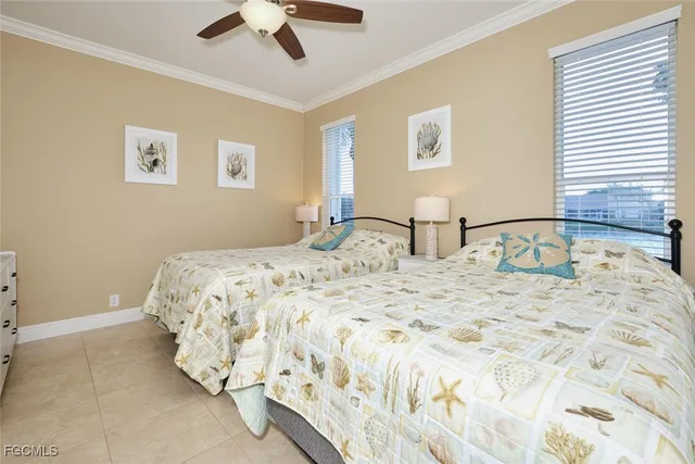 a bedroom with a bed and painting on the wall