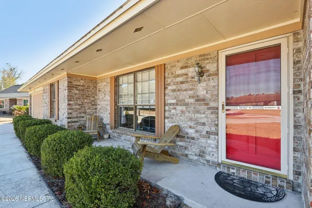 a view of a porch with furniture