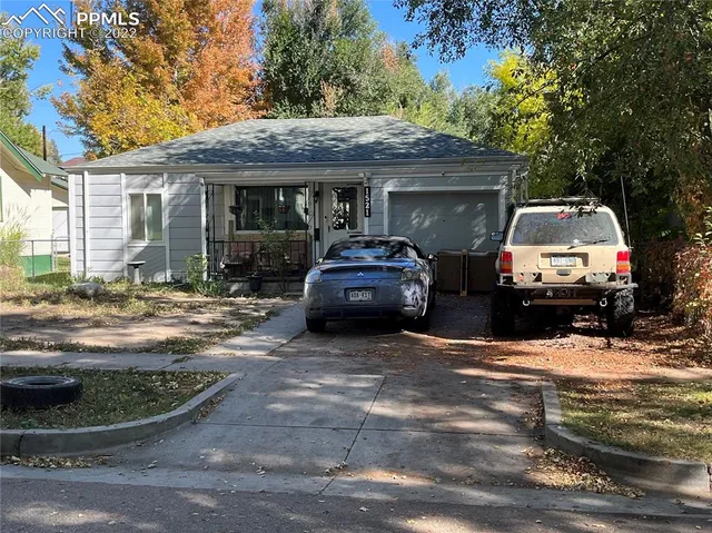 a view of a car parked in front of a house