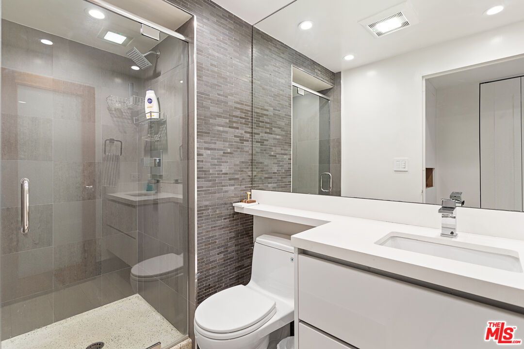 10501 Wilshire Boulevard, Unit 1605 Los Angeles, CA 90024 - Photo 14 of 27 a bathroom with a sink toilet and shower