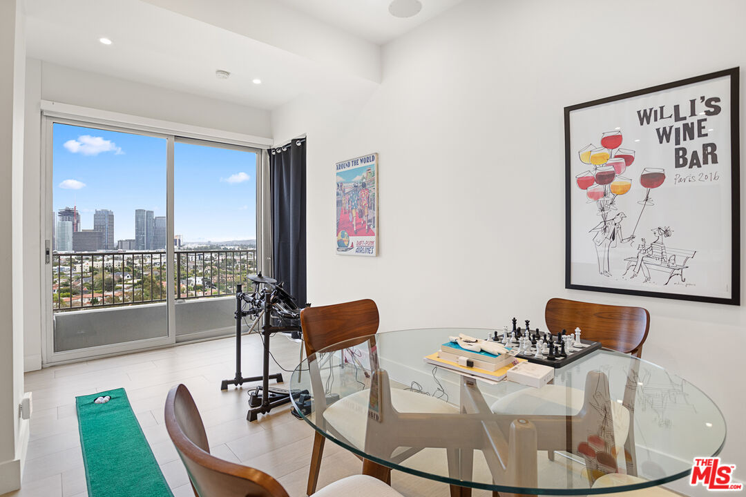 10501 Wilshire Boulevard, Unit 1605 Los Angeles, CA 90024 - Photo 15 of 27 a work room with furniture and a large window