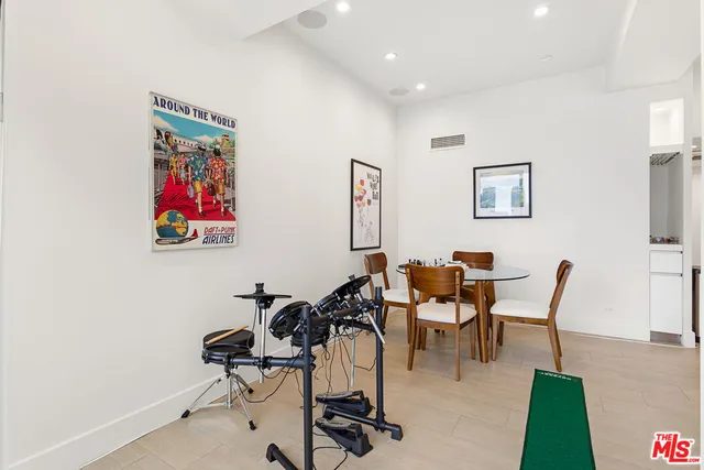 a view of a livingroom with furniture and a work space